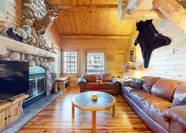 Dining room with log table and antler chandelier